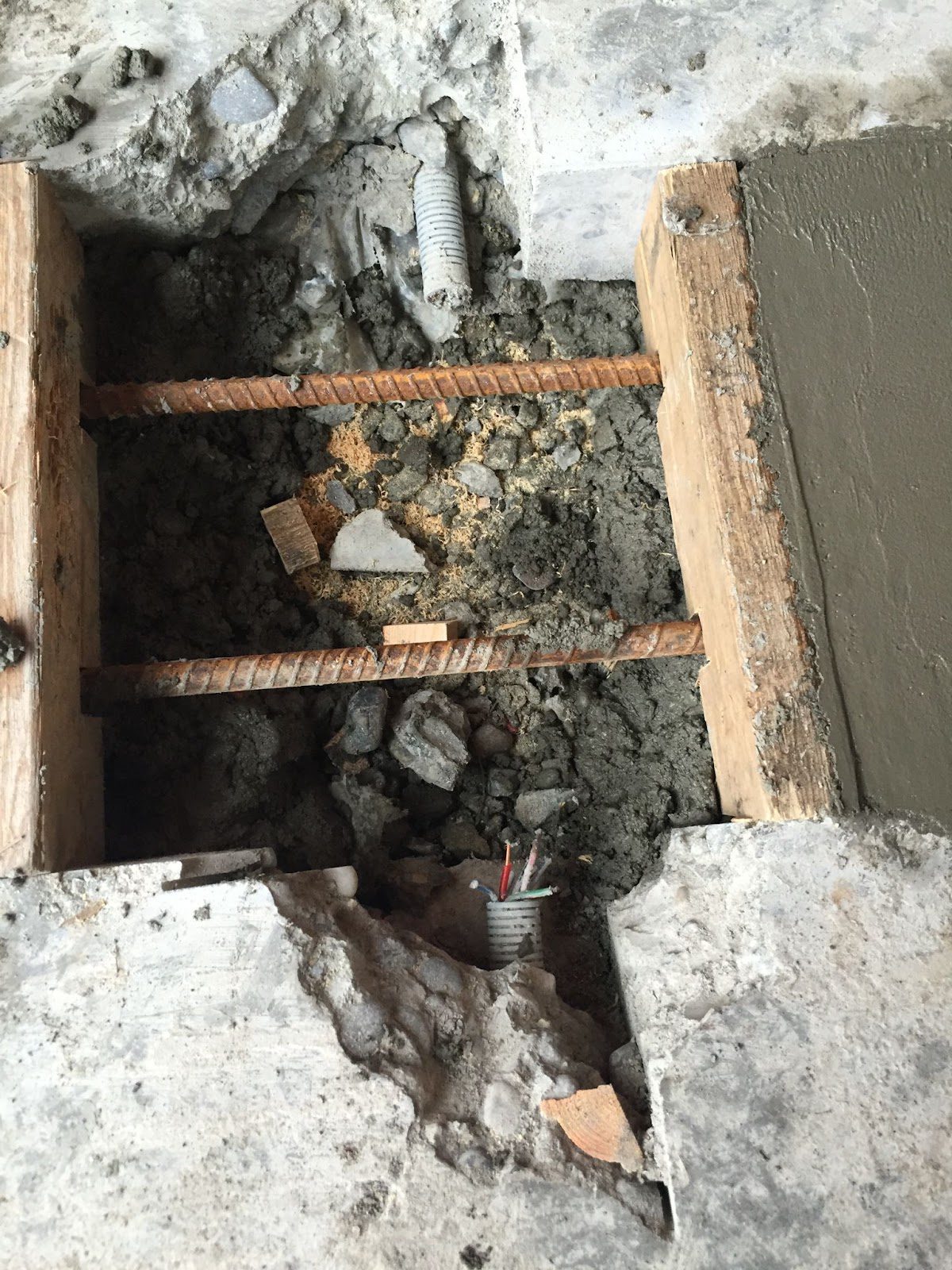 Rebar and electrical conduit within in a concrete slab